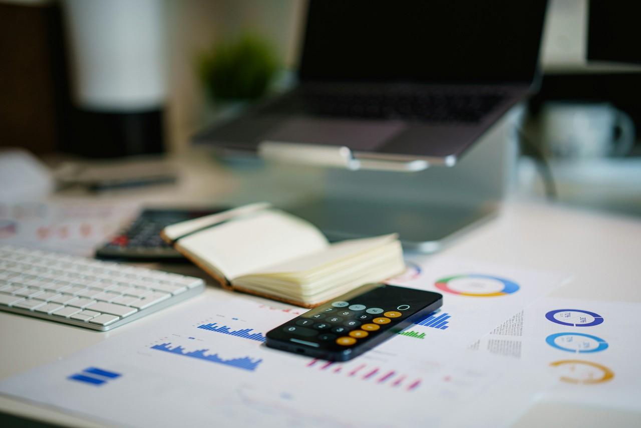 Spreadsheets and calculator on table